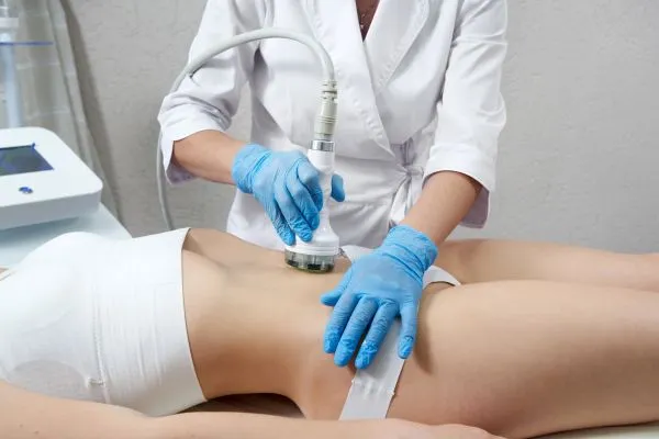 Lost the Weight but Not the Loose Skin? 2 woman having HIFU treatment on her stomach to combat loose skin Rickmansworth following weight loss